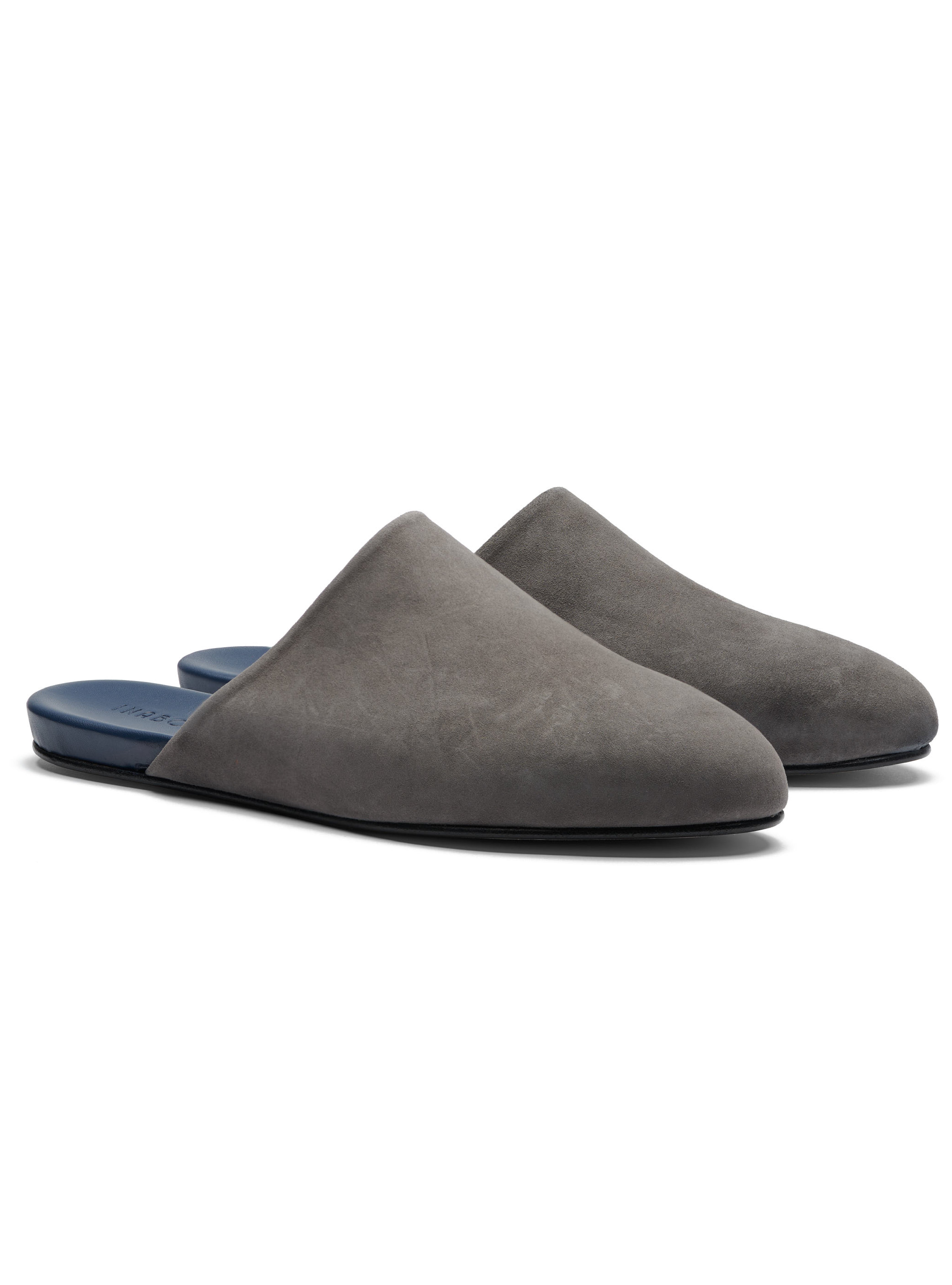 Men's pair of grey suede slippers on a white background