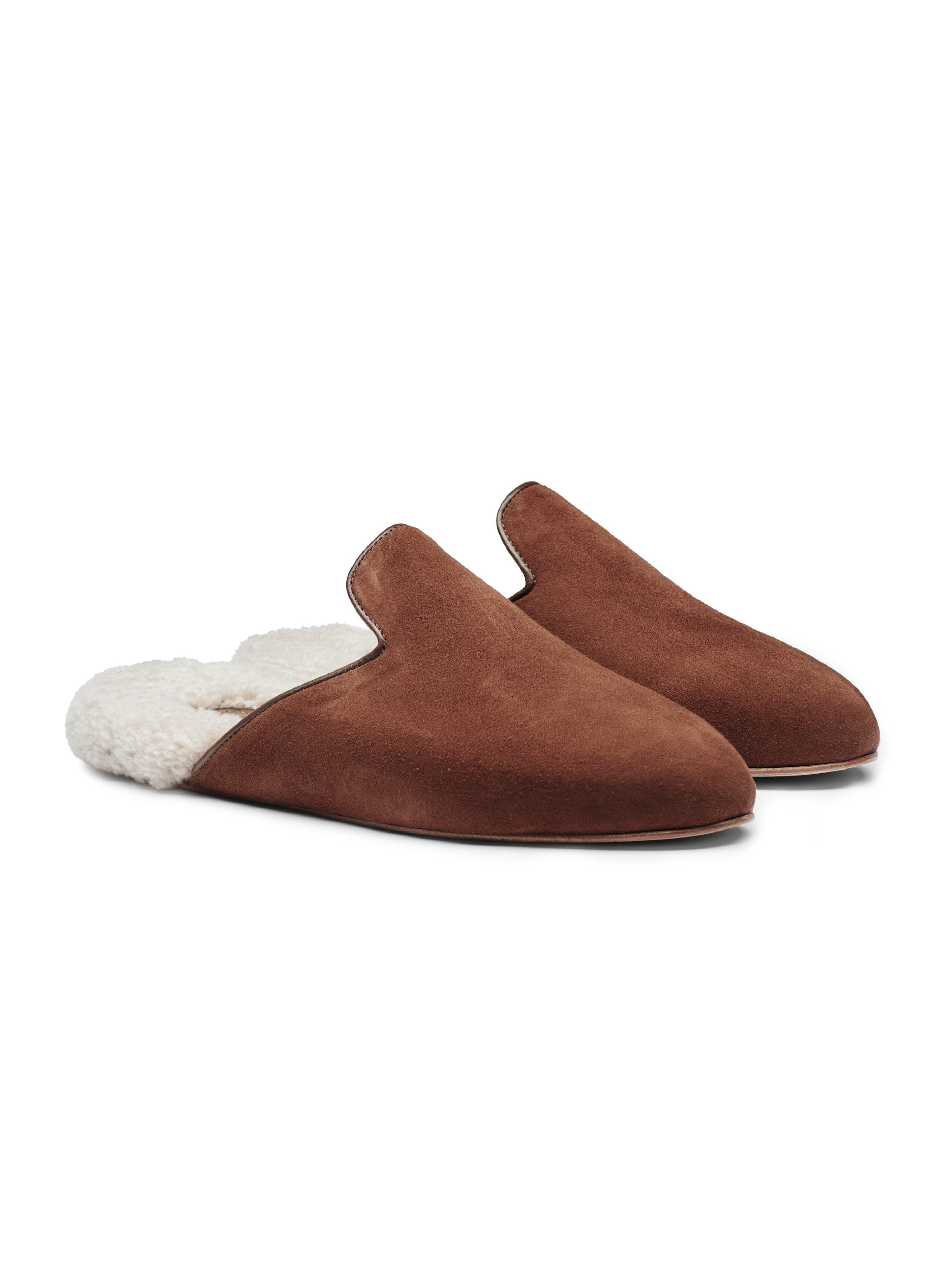 Men's pair of brown suede slippers with white fur lining on a white background