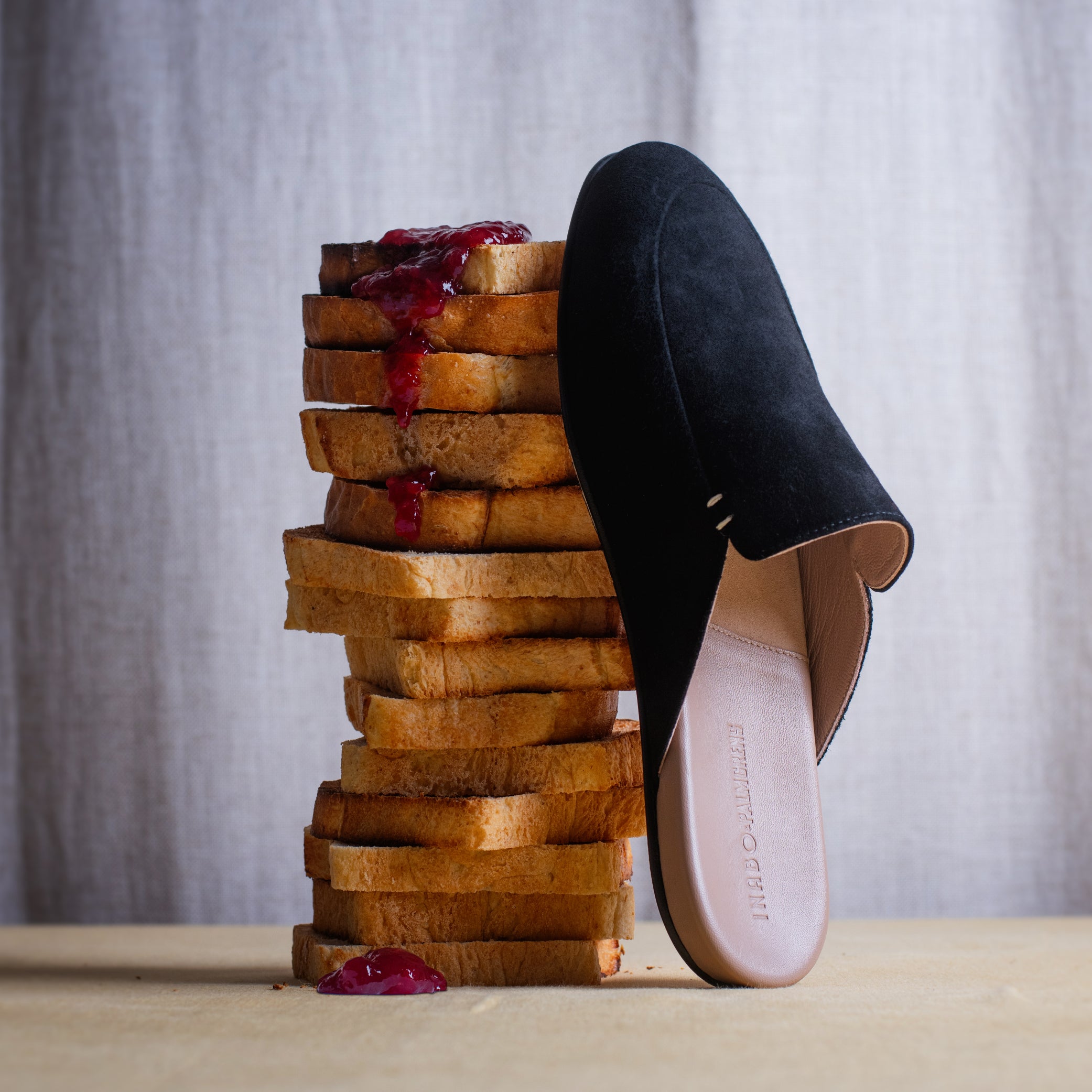 Women's black suede slippers still life picture