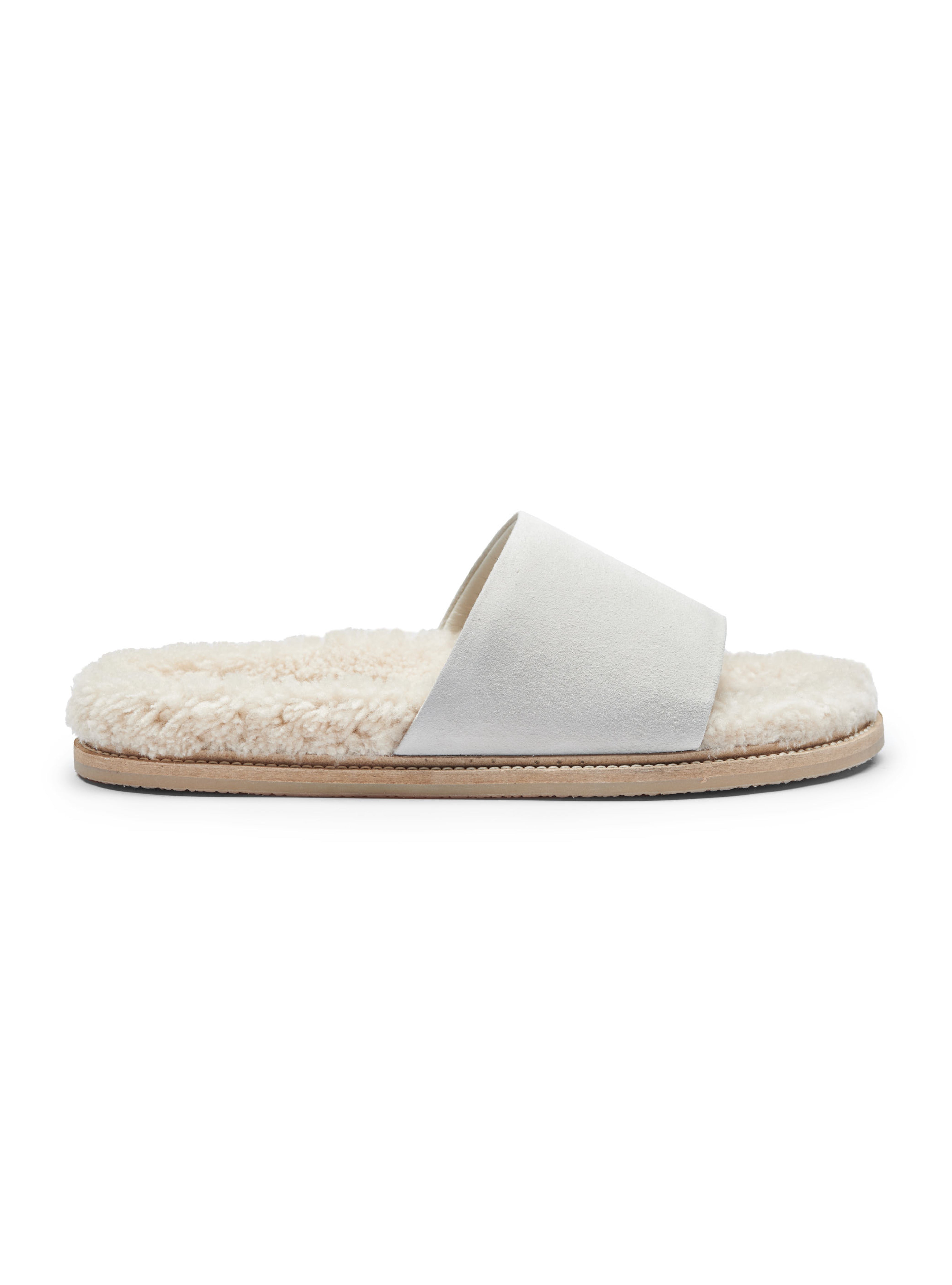 Women's white slipper with shearling lining on a white background
