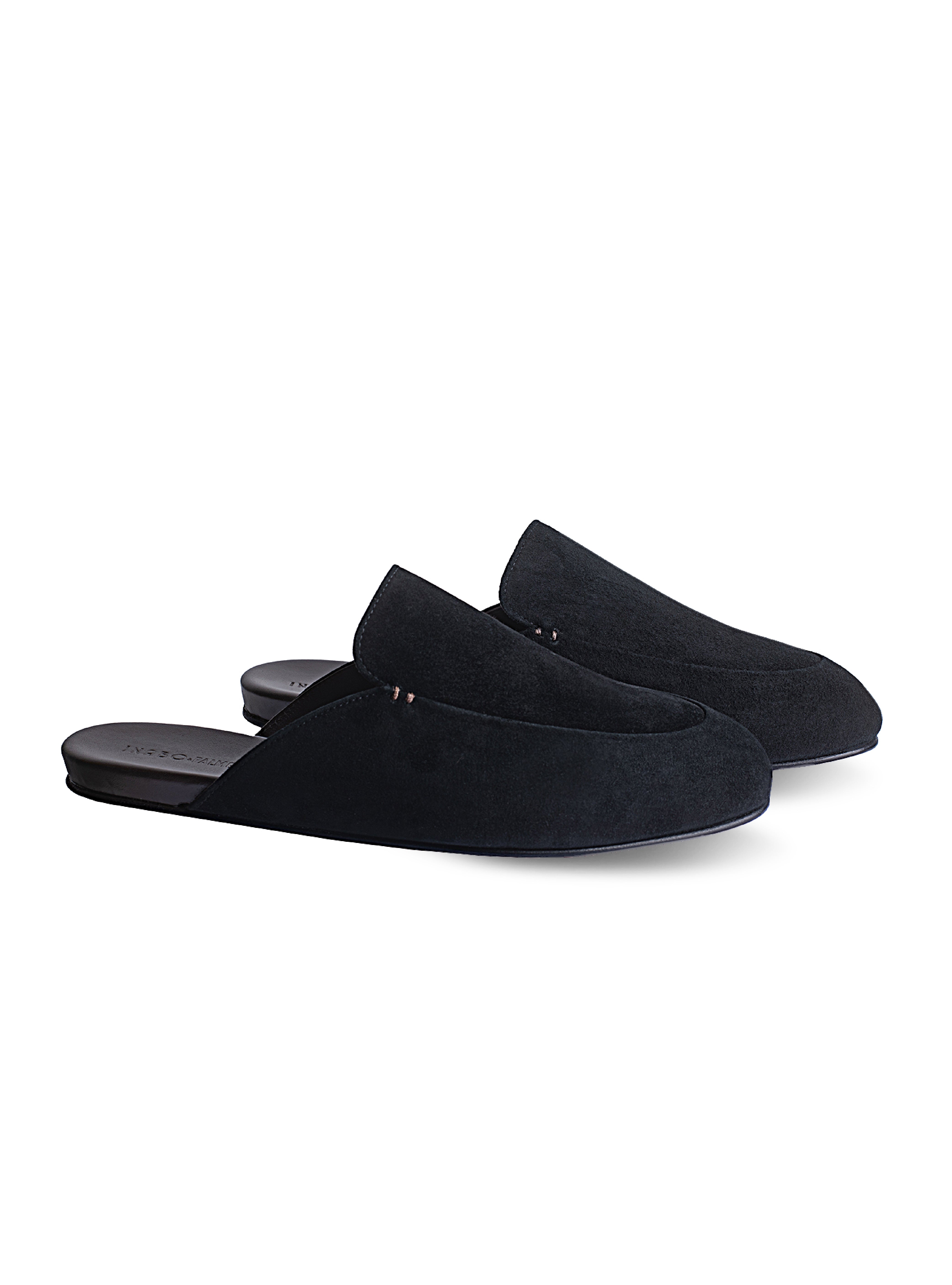Men's pair of black suede loafer slippers on a white background
