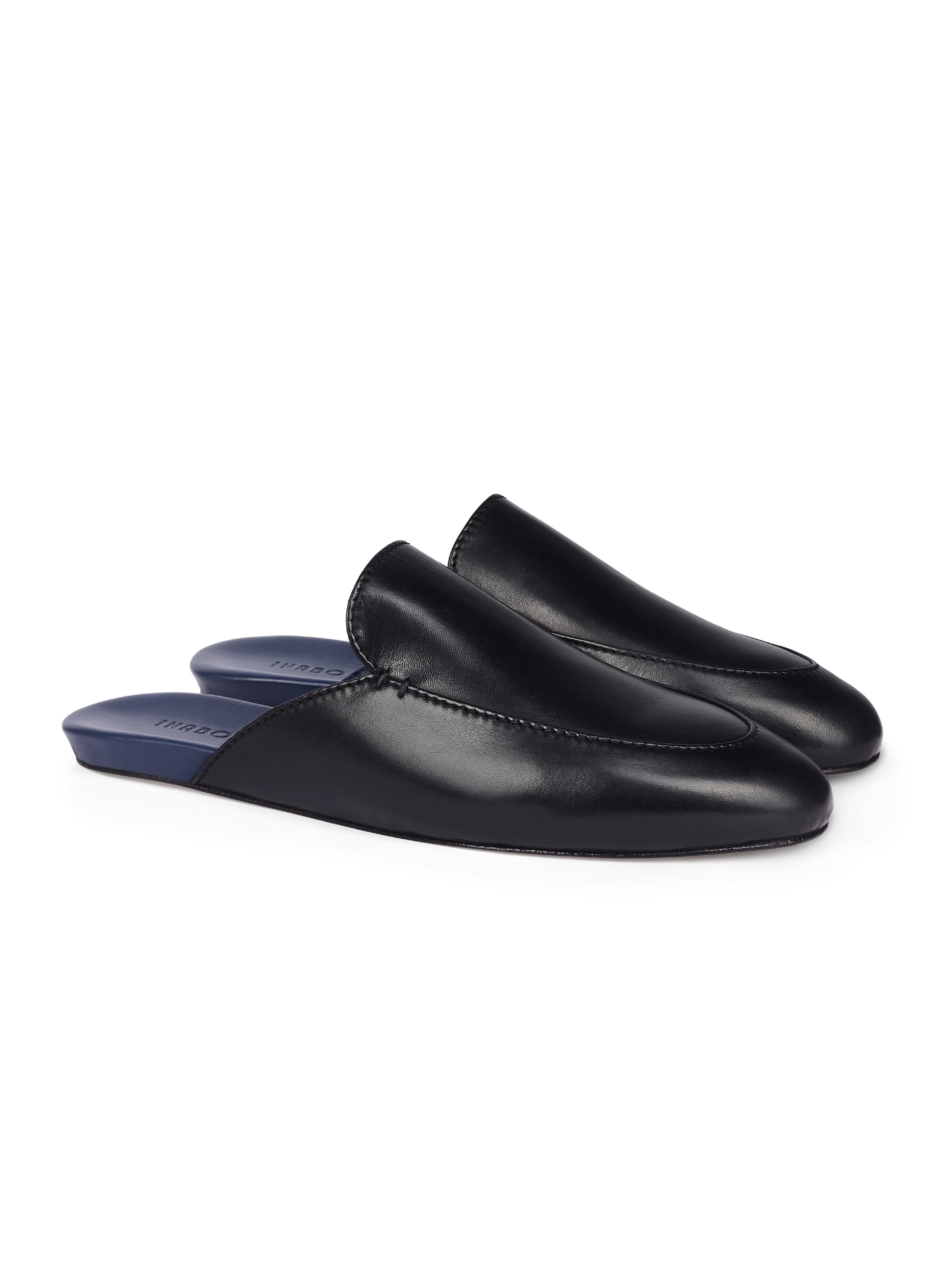 Men's black leather loafers with blue soles on a white background