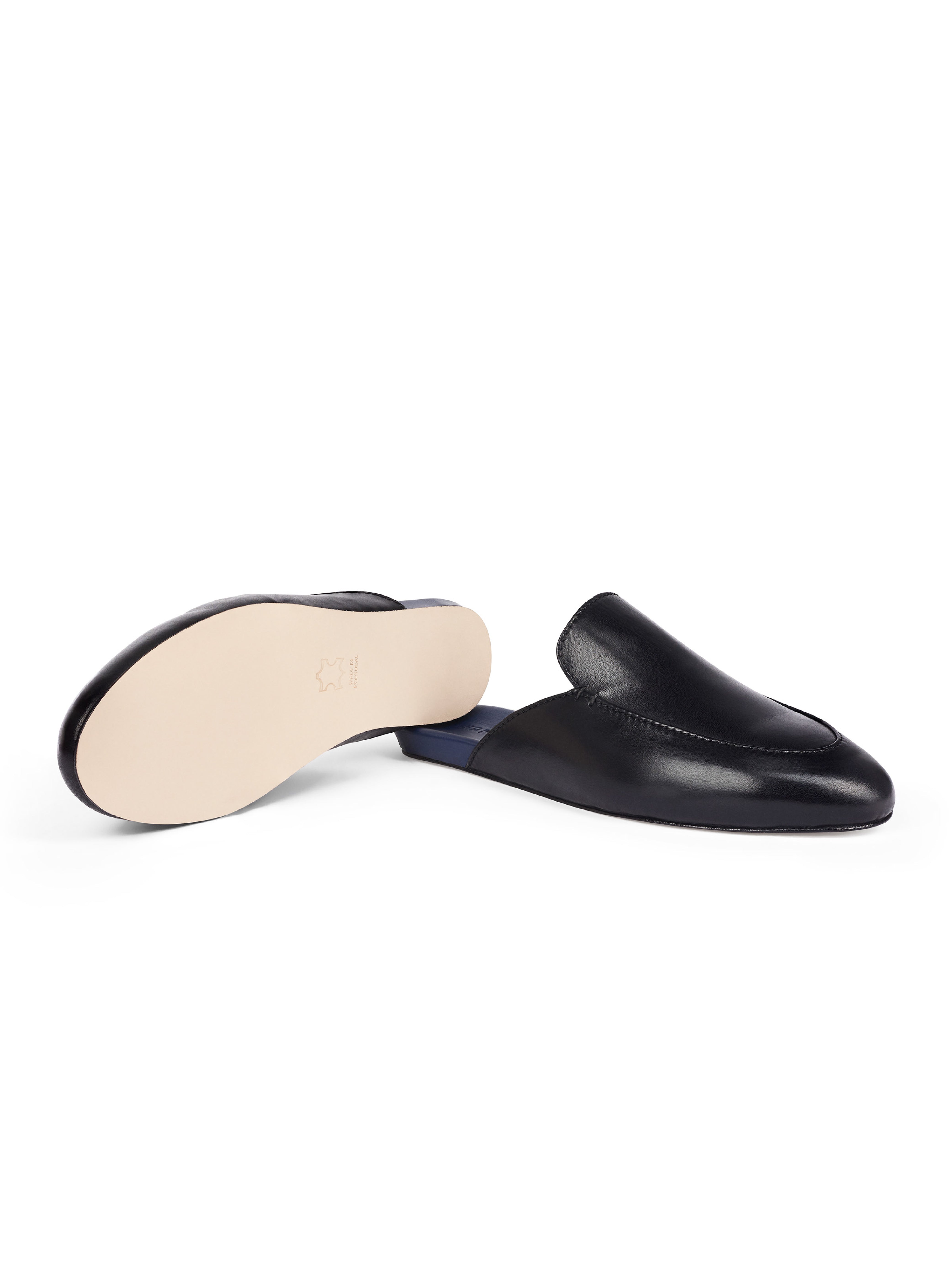 Men's black leather loafers with blue soles and leather outsole on a white background
