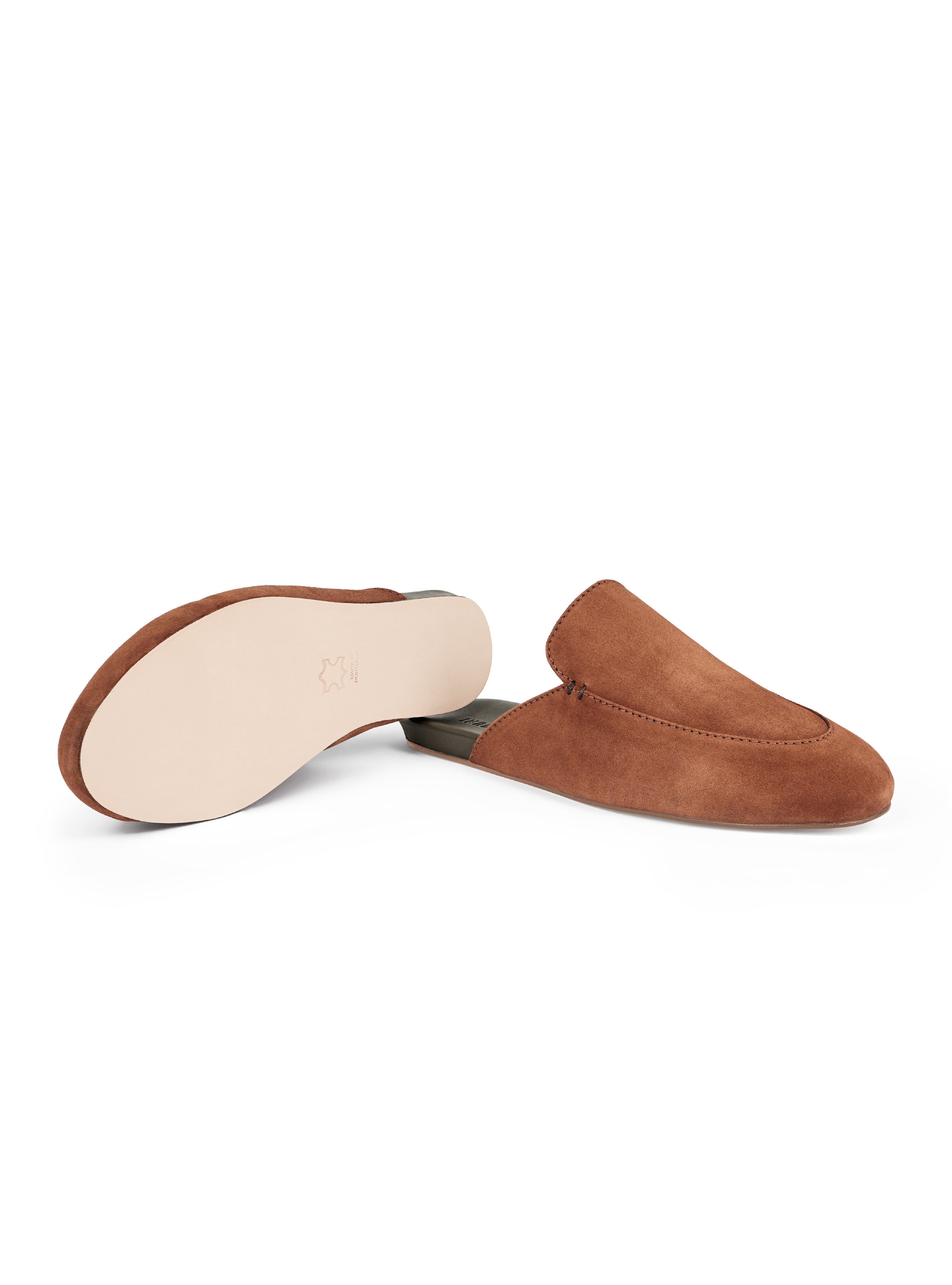 Men's pair of brown suede loafers with leather outsole on a white background