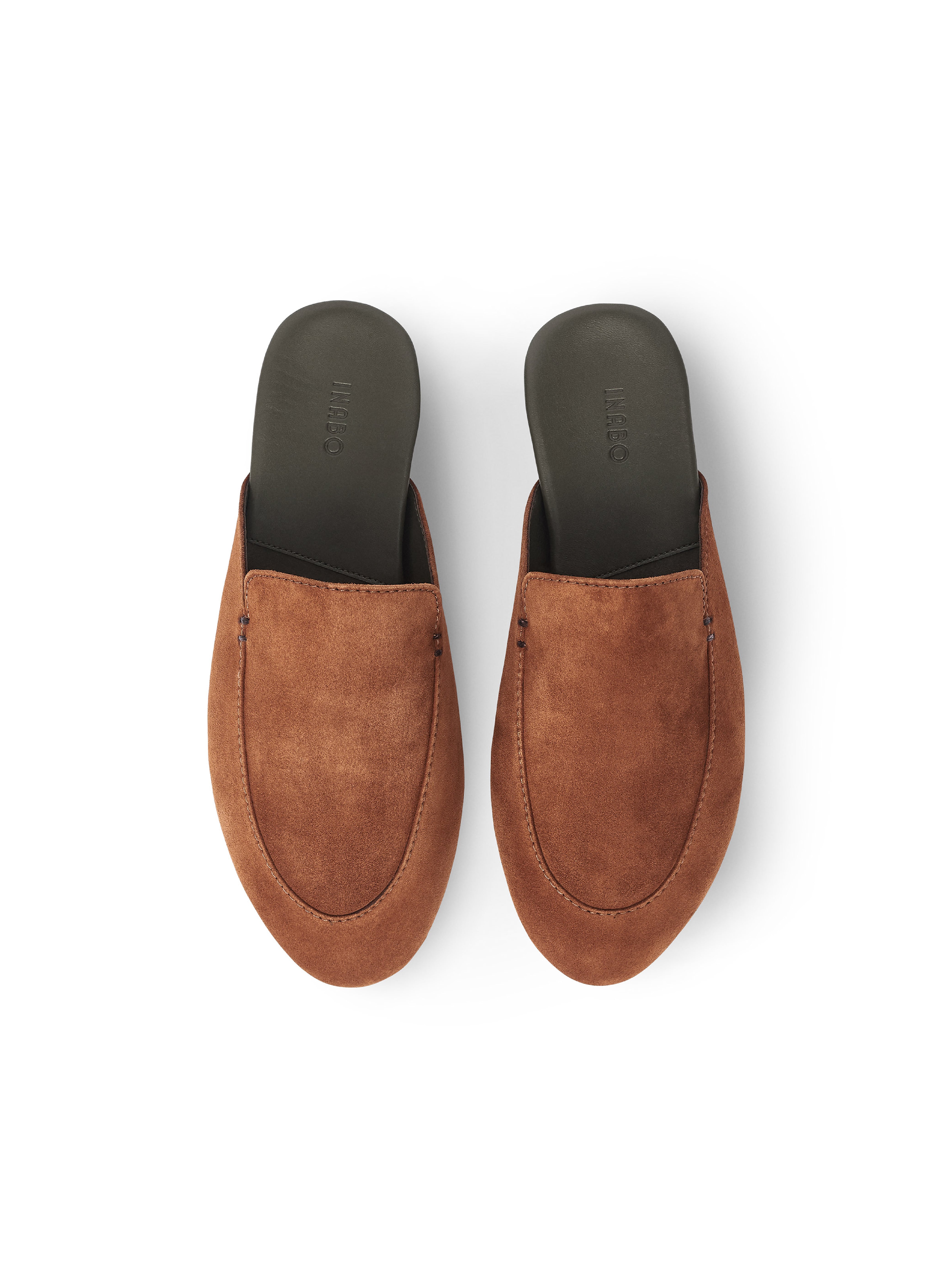 Men's pair of brown suede loafers on a white background