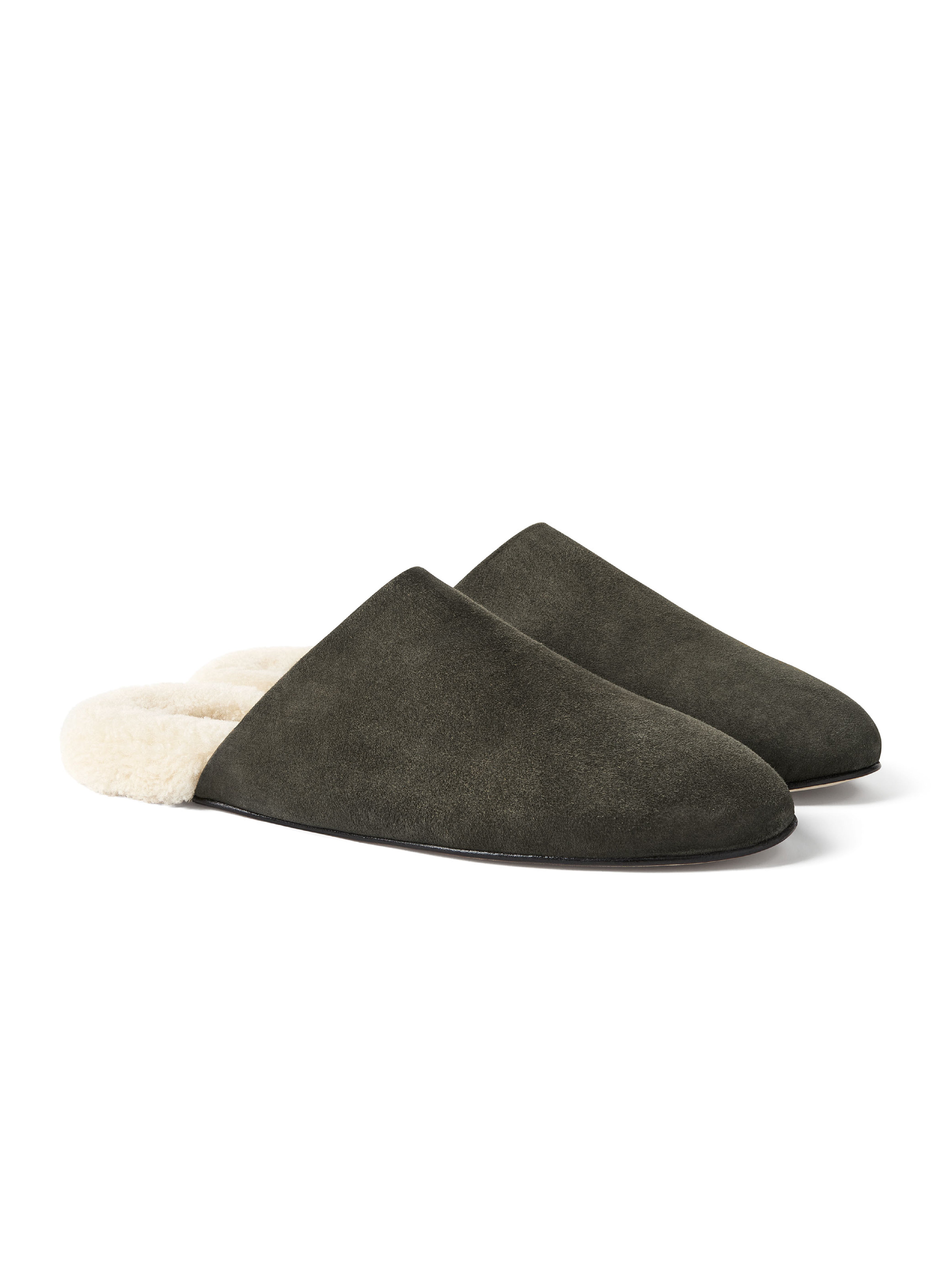 Men's pair of green suede slippers with white fur lining on a white background