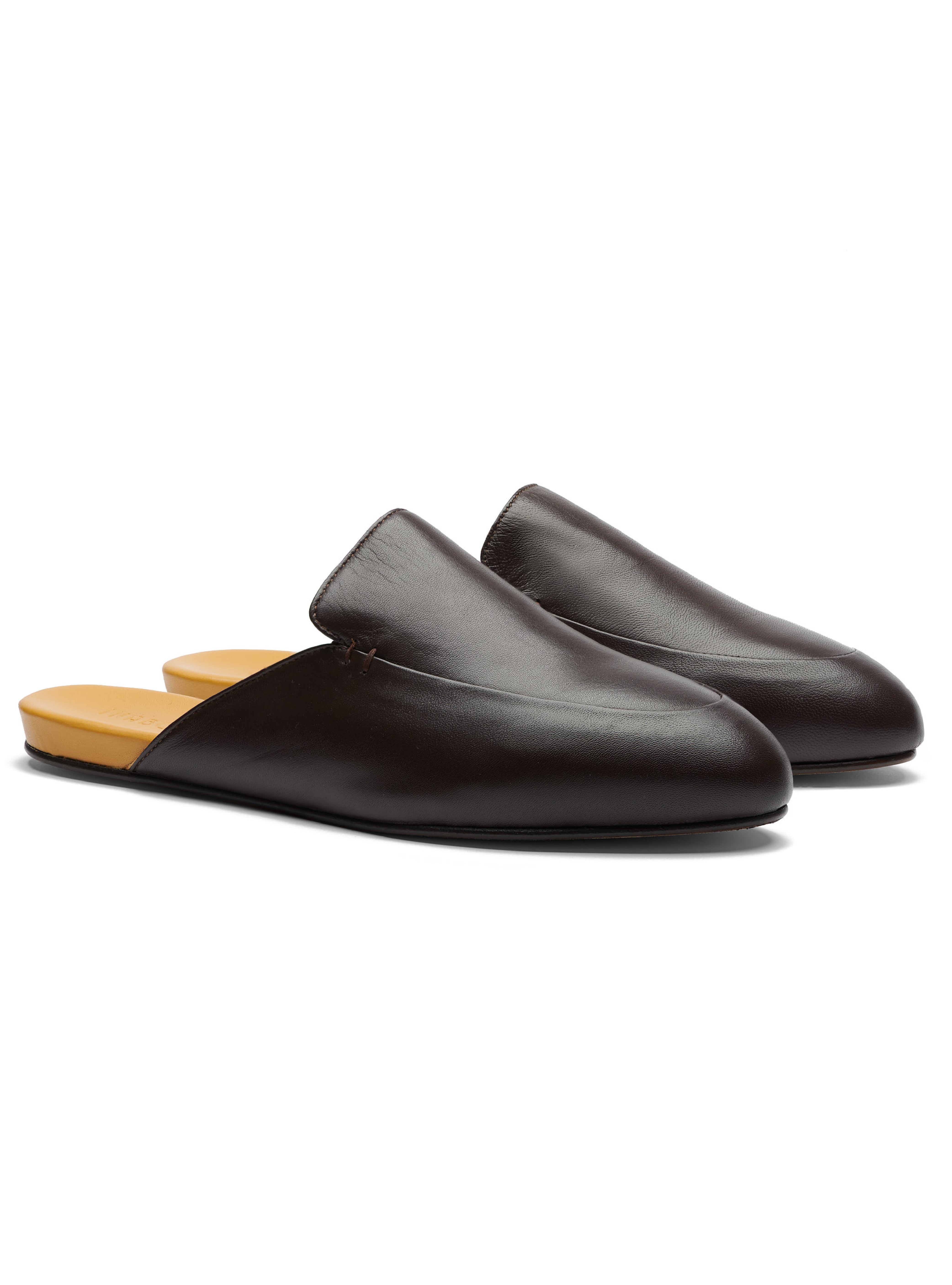 Men's pair of dark brown leather loafers on a white background