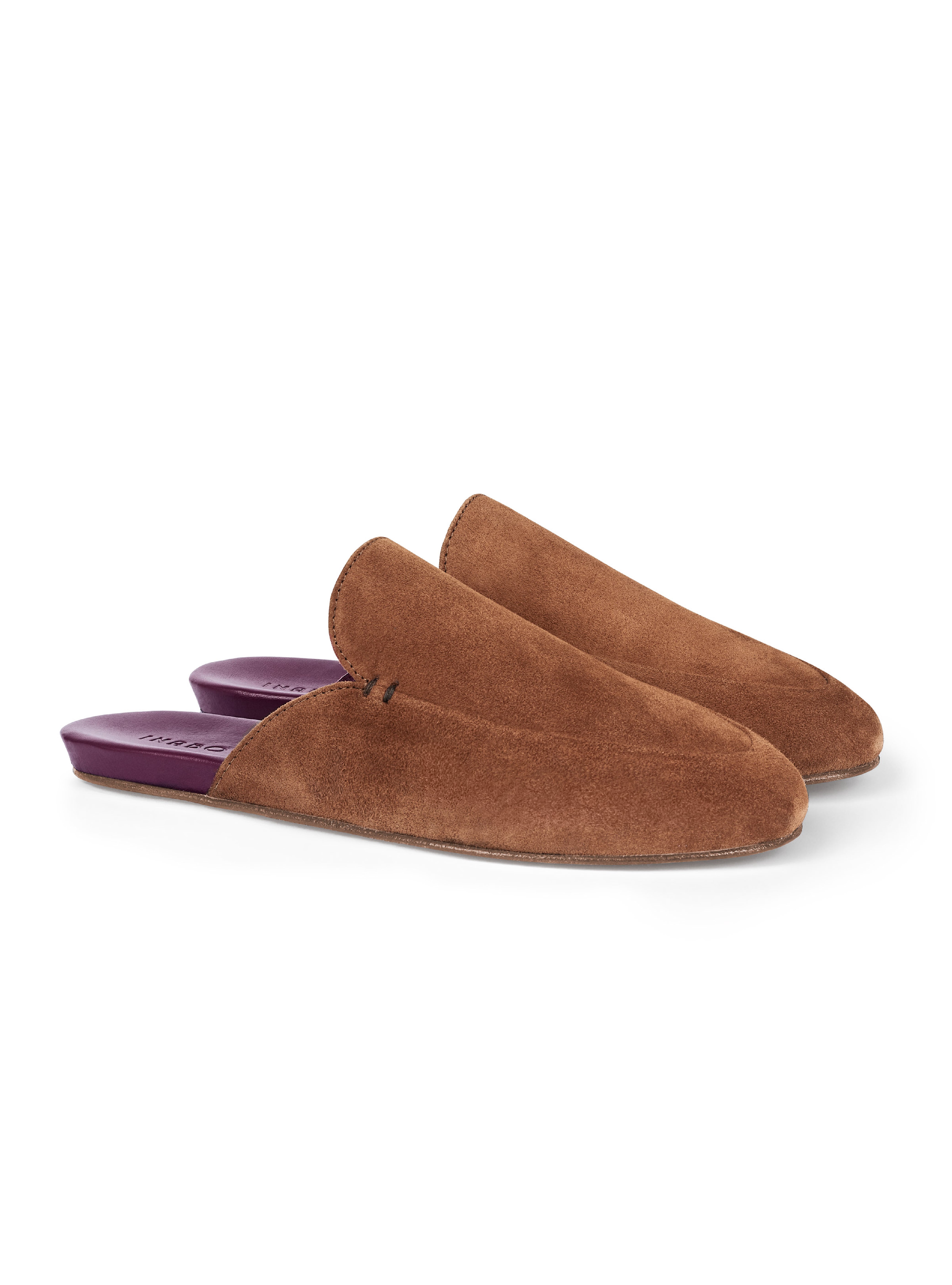 Women's pair of brown suede slippers with a burgundy insole on a white background.