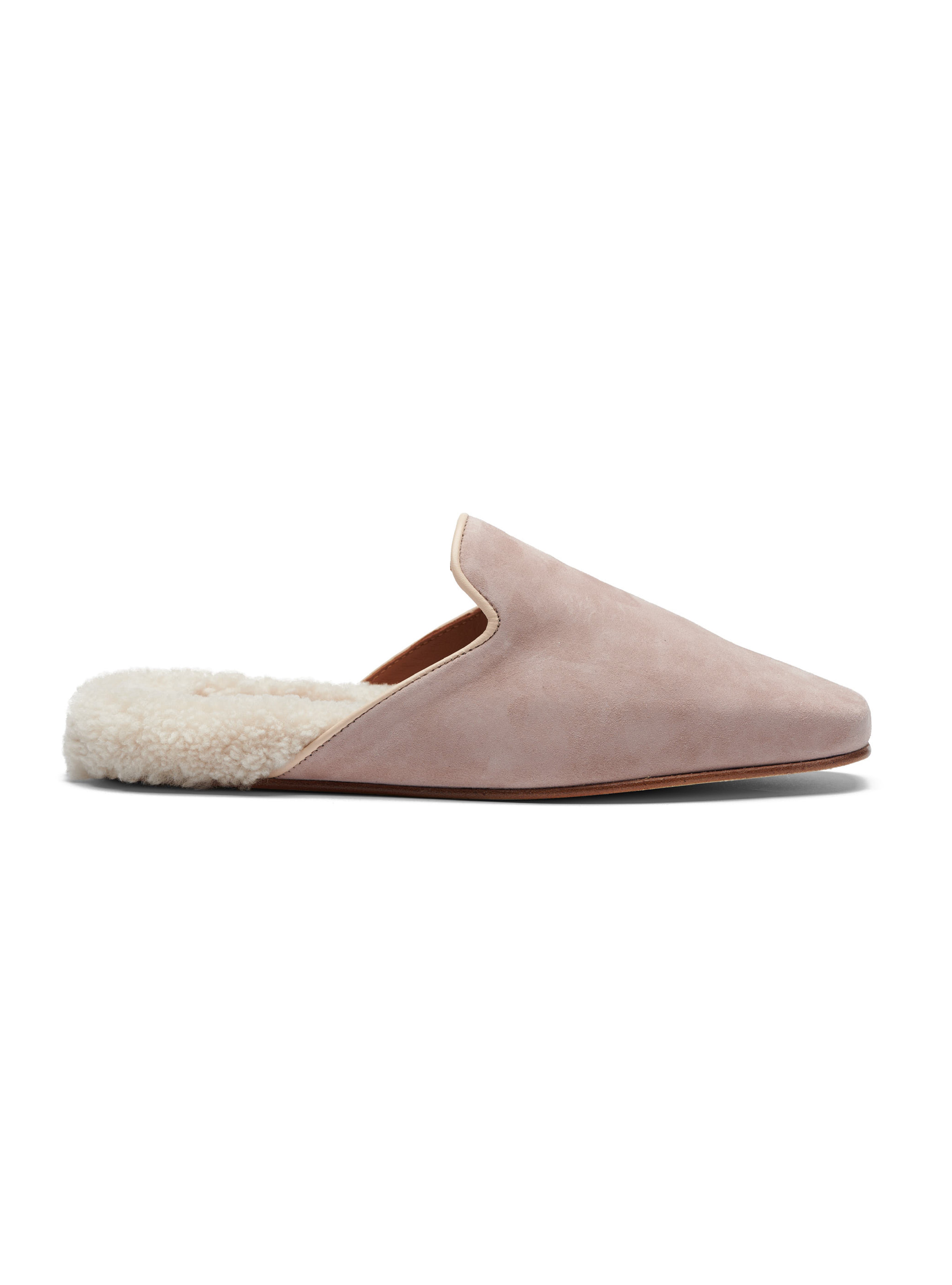 Women's pink suede slipper with shearling lining on a white background