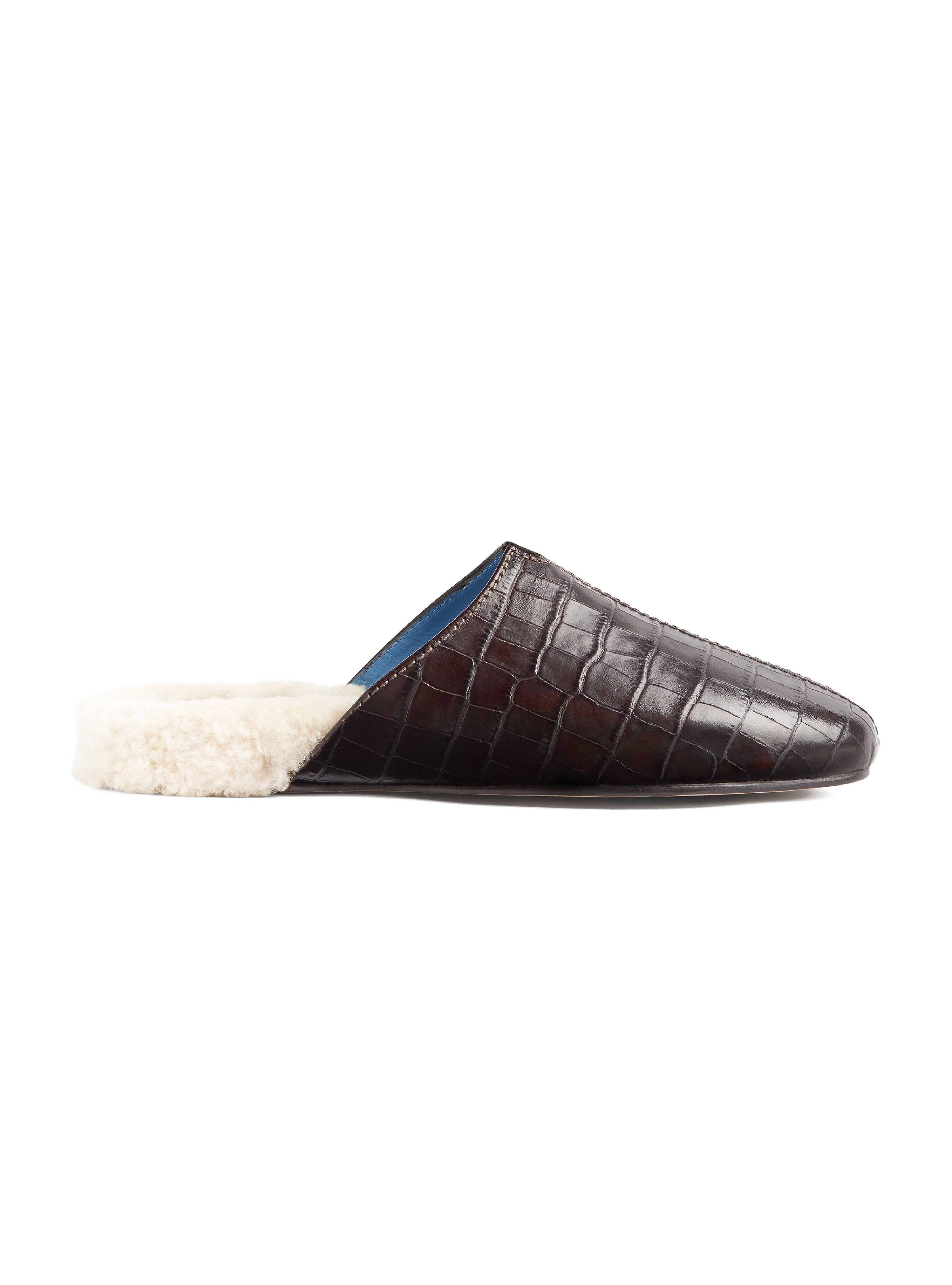 Women's croc-embossed dark brown leather slipper with white lining on a white background