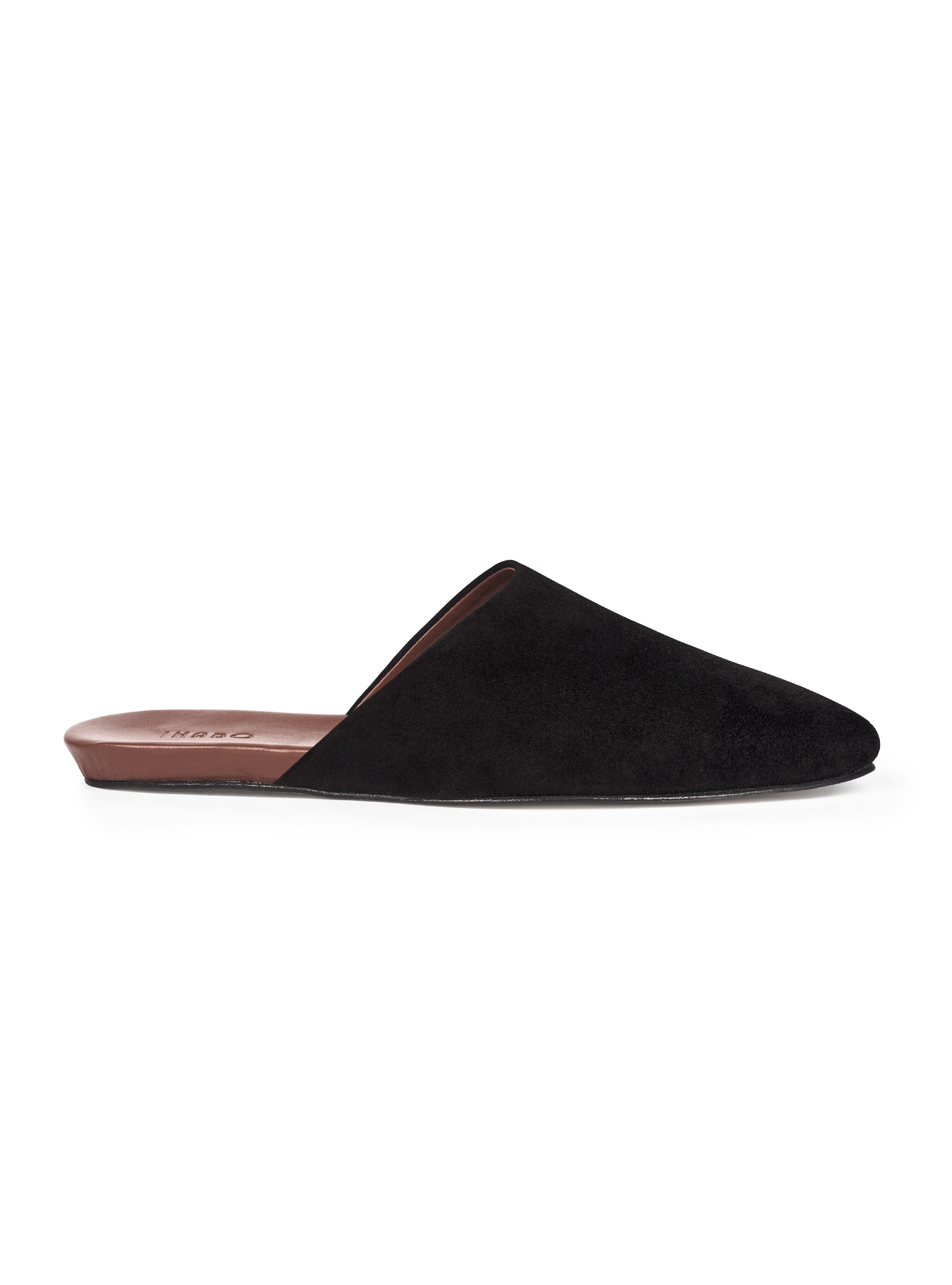 Women's black suede slip-on shoe on a white background