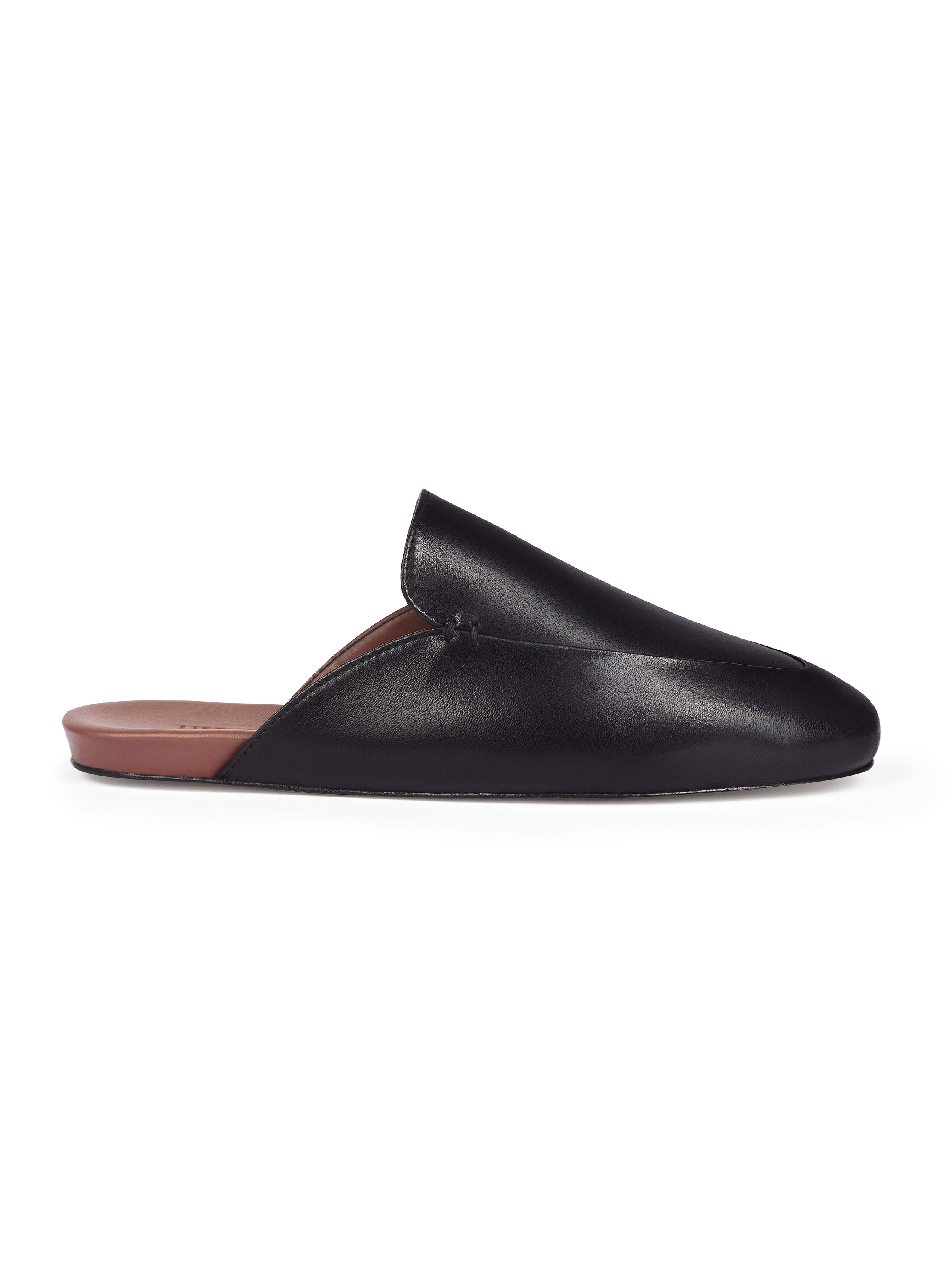 Women's black leather loafer on a white background.